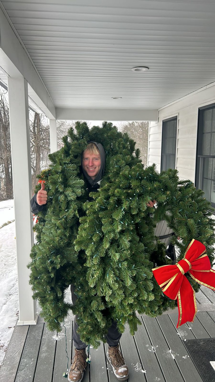 Holiday lighting crew work on a Pittsburgh property